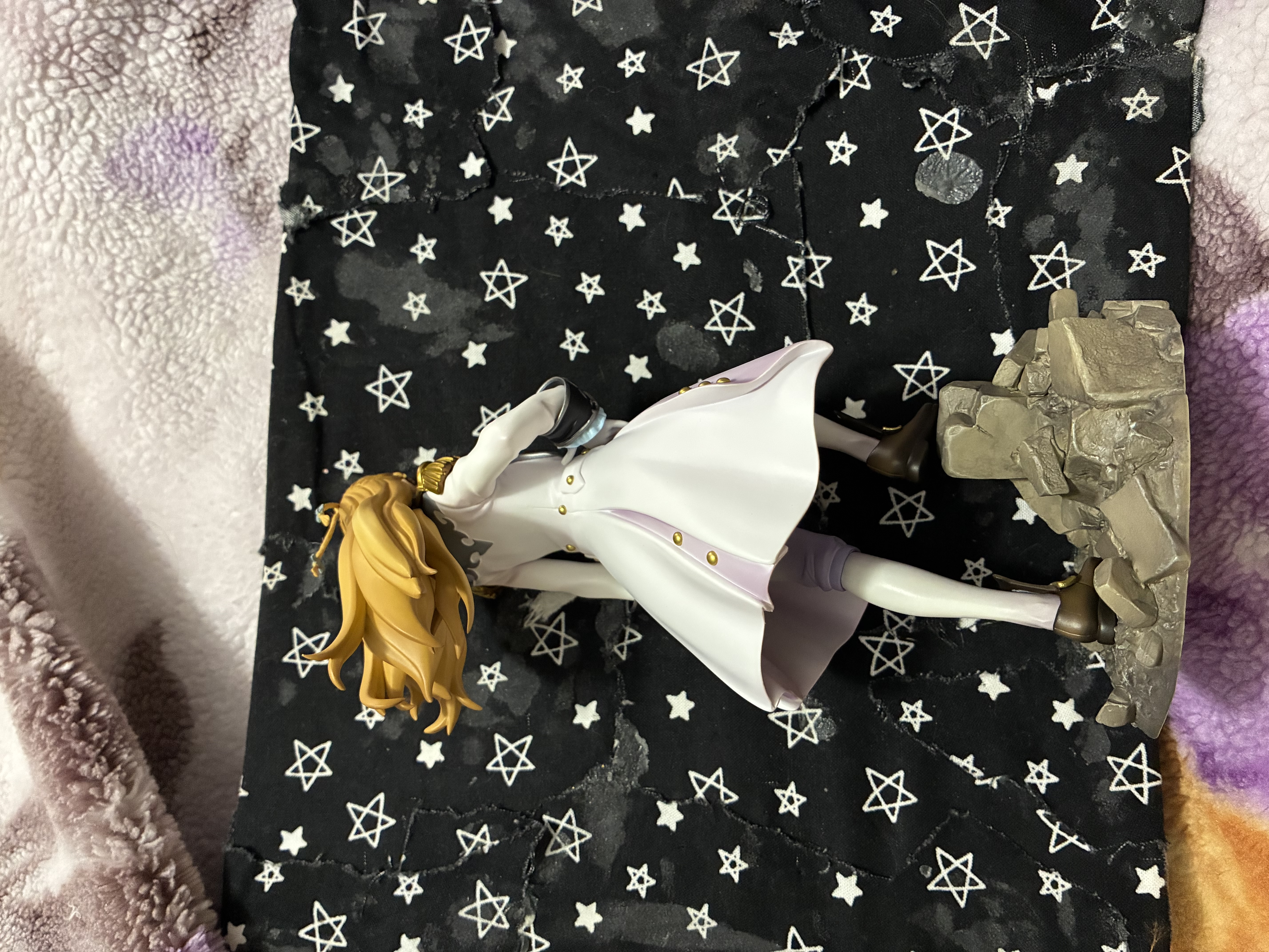 Back of Gundam wing Relena figure in her Sanc outfit standing on rubble.